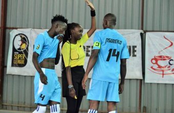 Rashida Adams earning her refereeing stripes in futsal in Uganda