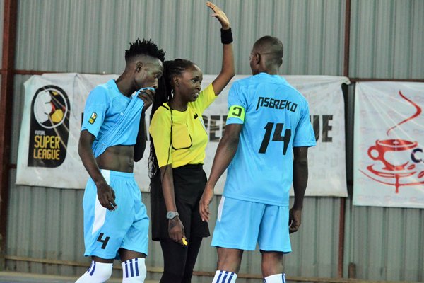 Rashida Adams earning her refereeing stripes in futsal in Uganda
